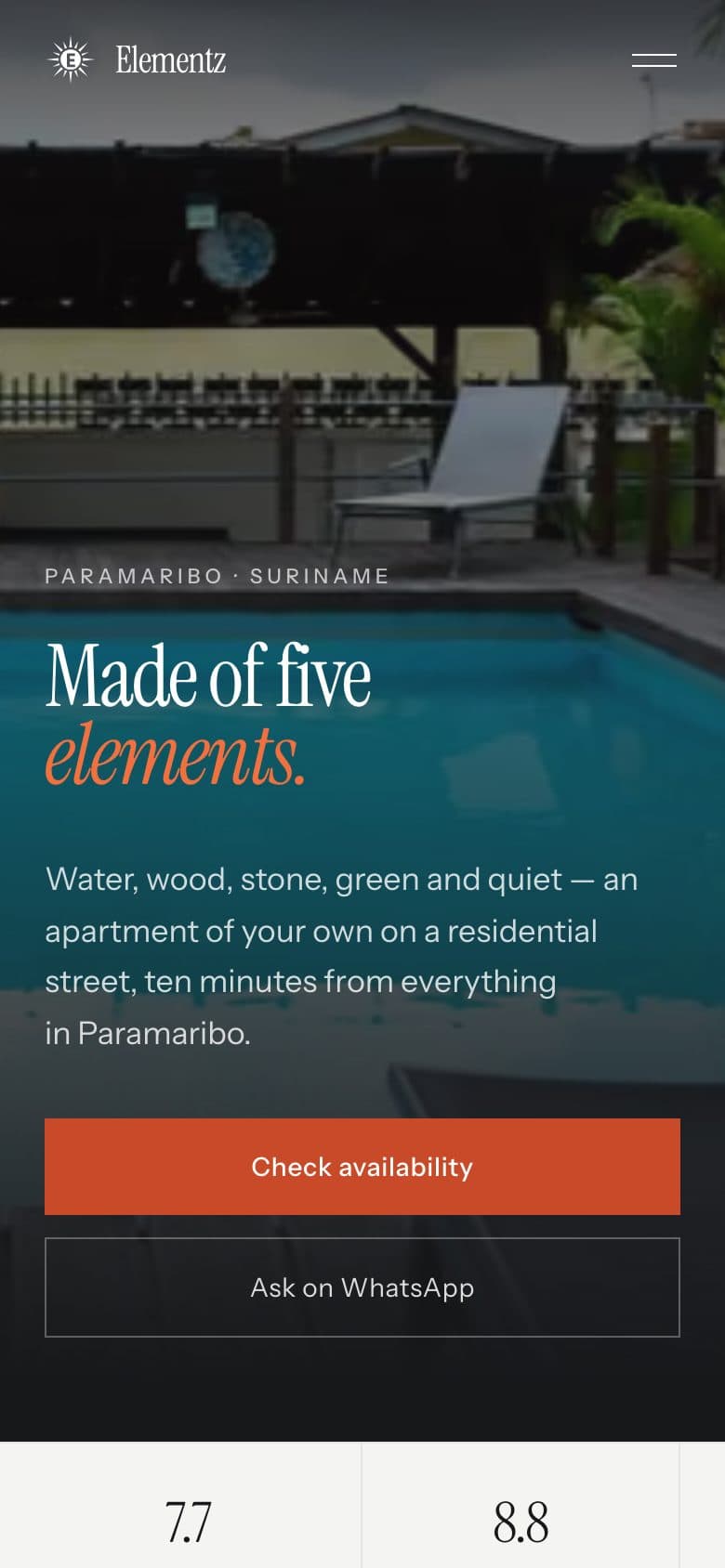 The Elementz Apartments home page on a phone: the pool photograph behind the headline, with the availability and WhatsApp buttons stacked below